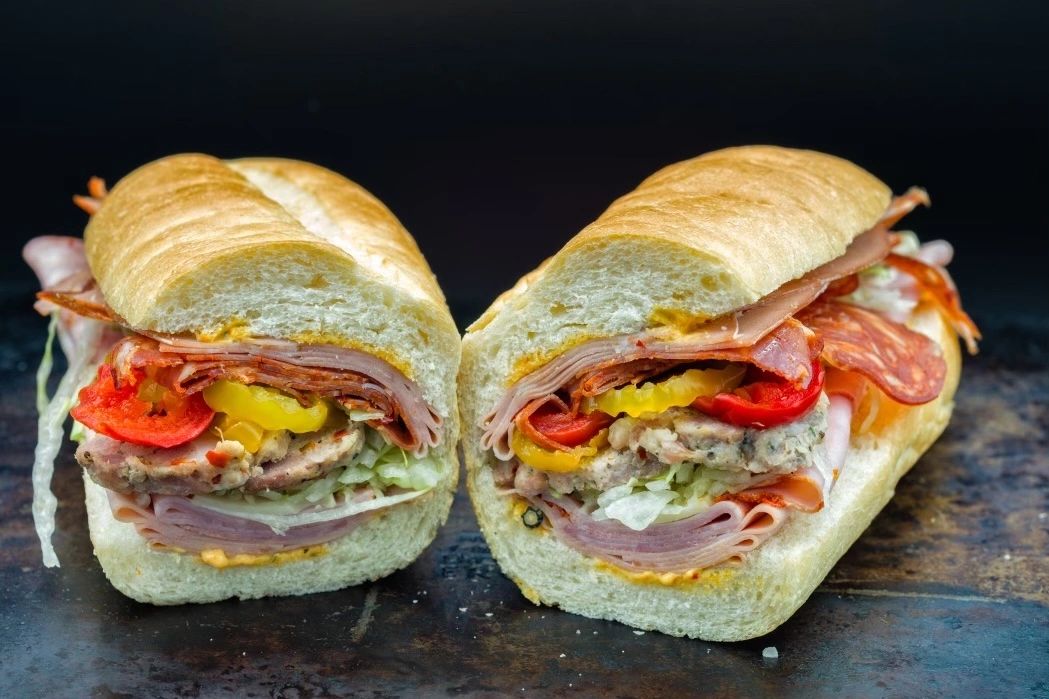 Peppino's gourmet Italian sandwiches on crusty rolls with deli meats and fresh vegetables